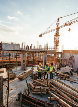 Investors and contractors on construction site