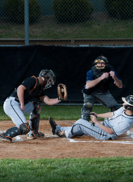 Baseball Player Slides Into Home Plate