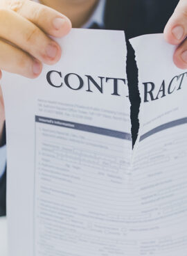 Cancellation of the contract. Businessman tear the contract.