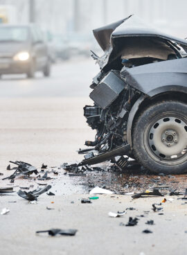 Car crash in urban street with black car