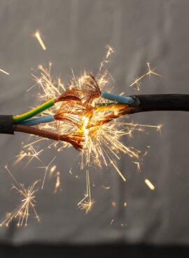 sparks explosion between electrical cables, fire hazard concept