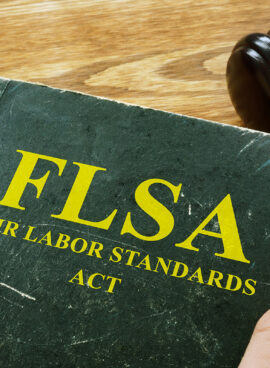 Man holds FLSA fair labor standards act.